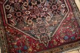 Corner detail of a collector's Farahan Sarouk rug highlighting the even pile and field abrash.