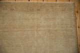 Close view of even wear across the knot heads of a vintage distressed Oushak carpet.