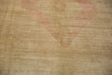 Even wear across the low-cut, hand-knotted pile of a distressed vintage Oushak carpet.