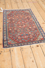 Vintage Persian Malayer rug with a detailed Herati motif viewed from a high angle.
