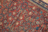 Low pile and even wear on a vintage Malayer rug with a detailed brick red and blue Herati motif.