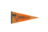 Vintage orange and green Tampa Bay felt pennant with 1970s football player graphic.
