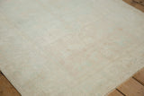 Low pile texture of a distressed Oushak rug showing even wear across the knot heads.