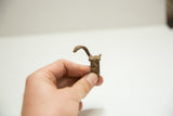 Side view of the vintage bronze snake ring highlighting its arched form and textured patina.