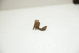 Profile view of a vintage African bronze snake ring showing its aged patina.