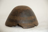 Hand-carved African bowl profile, showing the aged chip and incised decorative line work.
