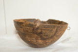 Vintage Wooden African Bowl with hand-carved geometric patterns, pronounced rim crack and repair.