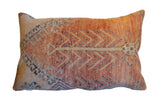 Vintage Rug Fragment Pillow in faded terracotta, beige, and teal with geometric motifs.