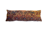 Vintage Kerman lumbar pillow with muted ruby, sapphire, and sand floral motifs, 16x42.