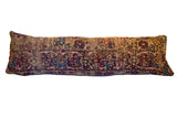 Vintage Rug Fragment Pillow featuring antique Kerman design in muted red, blue, and tan. 13x40 inches.