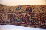 Worn texture of vintage Kerman rug pillow, showing visible foundation and fade.