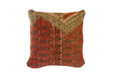 Antique circa 1910s Mir Serbend fragment pillow, red-orange with geometric blue and beige patterns.