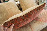 Side detail of vintage Mir Serbend rug fragment pillow, woven pattern and piping.