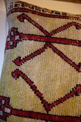 Hand-knotted vintage Turkish Oushak pillow showing textured pile and geometric pattern.