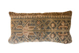 Vintage Rug Fragment Pillow with geometric patterns in earthy beige, blue, and green.