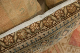 Vintage Rug Fragment Pillow, Persian hand-knotted with faded geometric pattern and light trim.
