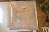 Vintage Oushak rug fragment pillow with faded peach and beige tones, 22x29.