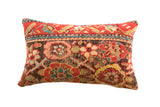 Vintage Rug Fragment Pillow, time-softened red, blue, and green floral patterns, 20x12.