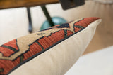 Close-up of antique Bijar pillow's hand-knotted rug fragment texture and black zipper.