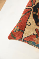 Antique Bijar rug fragment pillow displaying dense pile and geometric pattern in red, blue, and beige.