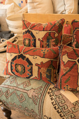 Group of antique Persian Bijar pillows with traditional geometric patterns.