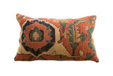 Antique Persian Bijar rug fragment pillow with rust, navy, and cream traditional motifs, 20x12.