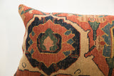 Intricate weave of antique Persian Bijar rug fragment pillow, featuring rich rust, blue, and tan.