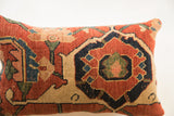 Early 20th century Persian Bijar rug fragment pillow, rich terracotta, indigo, and beige pattern.