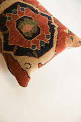 Hand-knotted texture and geometric motifs on antique Bijar rug fragment pillow.