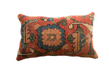 Antique early 20th century Persian Bijar pillow, red-orange and teal palmette motif.