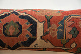 Antique Bijar rug fragment pillow, close-up of hand-knotted pile featuring red, navy, and beige.