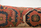Antique Bijar rug fragment pillow detail: terracotta, indigo, and beige stylized motifs.
