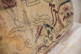Fine hand-knotted texture and beige, red, dark mythological pattern on vintage pillow.
