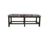 Vintage Turkish rug bench with a geometric pattern in lavender, raspberry, and teal on a dark ebony wood frame.