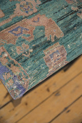 Textured corner of a reclaimed rug bench showing the weave of the vintage Turkish textile.