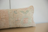 Hand-knotted texture and faded pastel blue-green, coral pattern on vintage Oushak pillow.