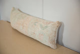 Vintage Rug Fragment Lumbar Pillow with distressed hand-knotted pile and muted tones.