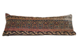 Vintage Kerman rug fragment lumbar pillow with intricate floral design, red and blue.