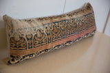 Side detail of the vintage Kerman rug fragment lumbar pillow, showing muted floral patterns.