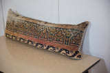 Elongated vintage Kerman rug fragment lumbar pillow, showcasing intricate pattern and texture.