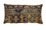 Antique Kerman rug fragment lumbar pillow with floral and cartouche motifs on an ochre gold ground.
