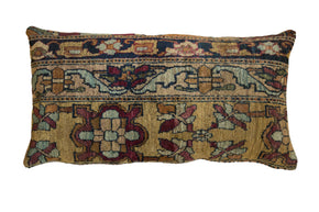 Antique Kerman rug fragment lumbar pillow with floral and cartouche motifs on an ochre gold ground.