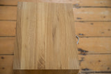 Overhead view of the solid oak grain on the wooden nightstand top.