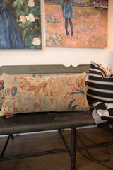 Antique Persian Sultanabad lumbar pillow displaying floral vinery in madder red, seafoam, and cobalt blue.