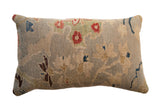 Antique Persian Sultanabad rug fragment lumbar pillow with seafoam, red, and cobalt floral vinery.