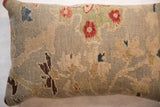 Textured pile of the antique Persian Sultanabad rug pillow with seafoam, cobalt, and red floral design.