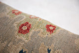 Antique Persian Sultanabad fragment pillow featuring textured pile with madder red flowers and seafoam green vines.