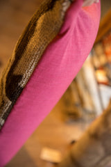 Textured vintage Turkish rug fragment and vivid pink fabric backing on pillow side.