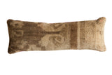 Reclaimed Vintage Turkish Oushak rug fragment lumbar pillow, muted brown and beige tribal patterns, 10x31.