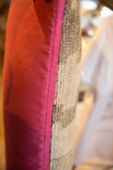 Pink remnant fabric backing meets textured vintage Turkish rug fragment.